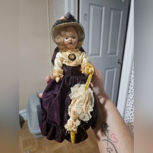 Elegant Victorian Doll with Purple Dress
